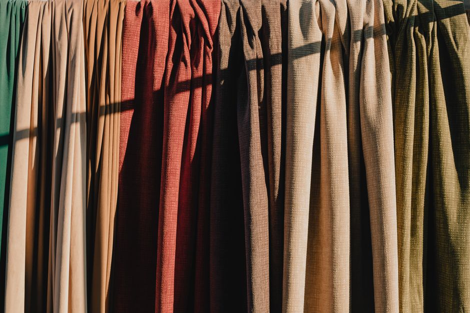 Fabric roman shades providing soft light filtering in a room