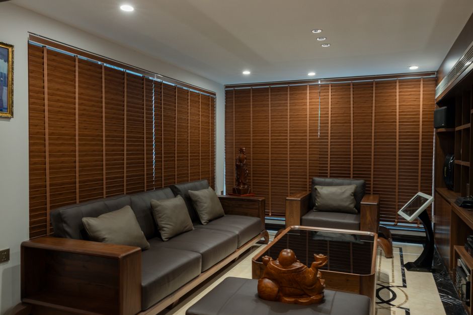 Modern living room with custom window blinds and soft natural light